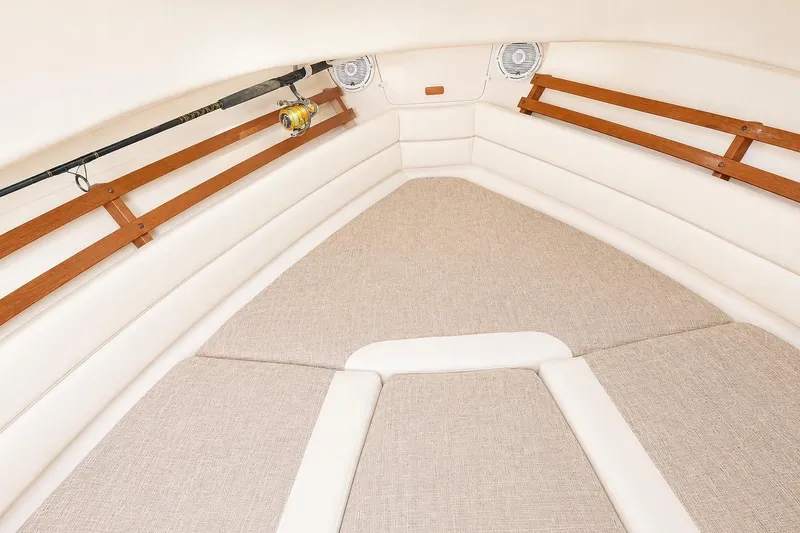 Slide: The Image of Interior cabin of 2007 Grady-White Marlin 300 boat with cushioned seating and rod storage. - 10