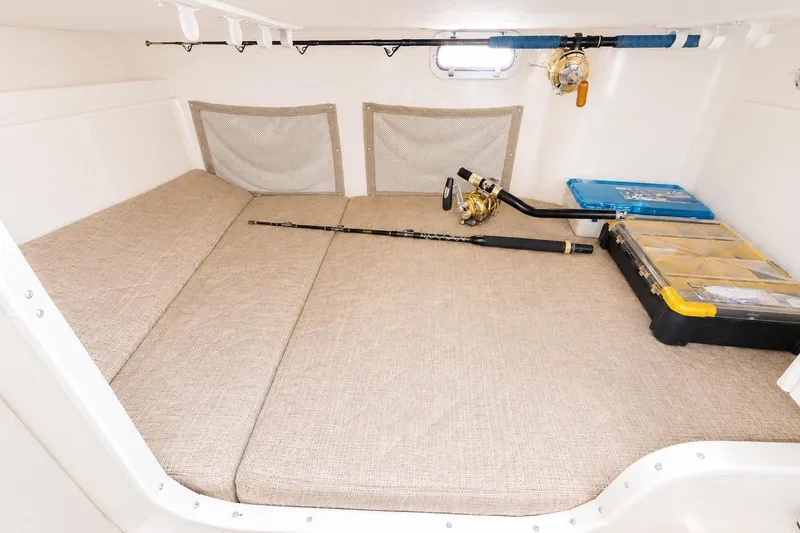 Slide: The Image of Interior cabin of 2007 Grady-White Marlin 300 with fishing gear and storage boxes. - 11