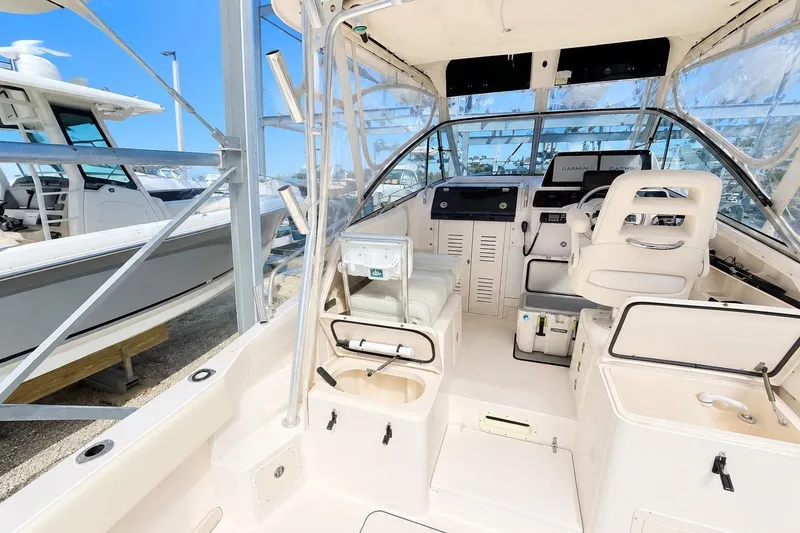 Slide: The Image of 2007 Grady-White Marlin 300 boat interior with helm, seating, and navigation equipment. - 15