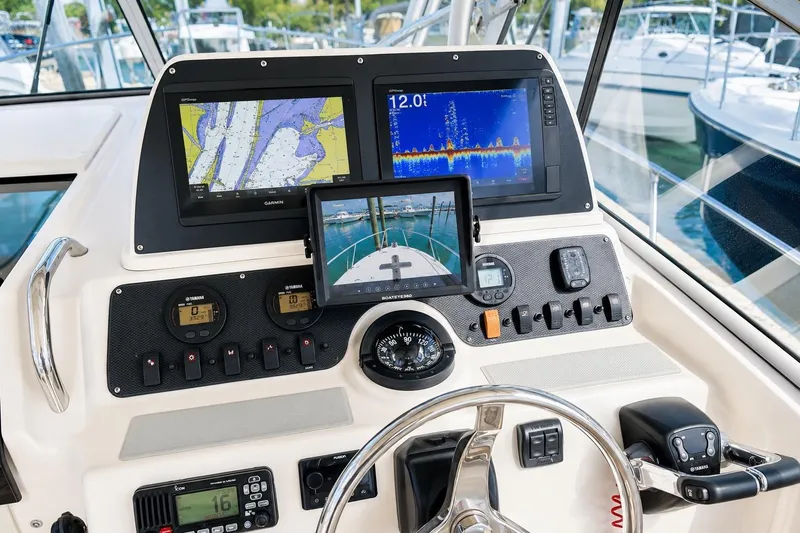 Slide: The Image of 2007 Grady-White Marlin 300 helm with advanced navigation and control systems. - 2