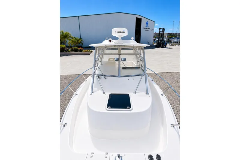 Slide: The Image of 2007 Grady-White Marlin 300 boat with Garmin radar, docked at a marina. - 7