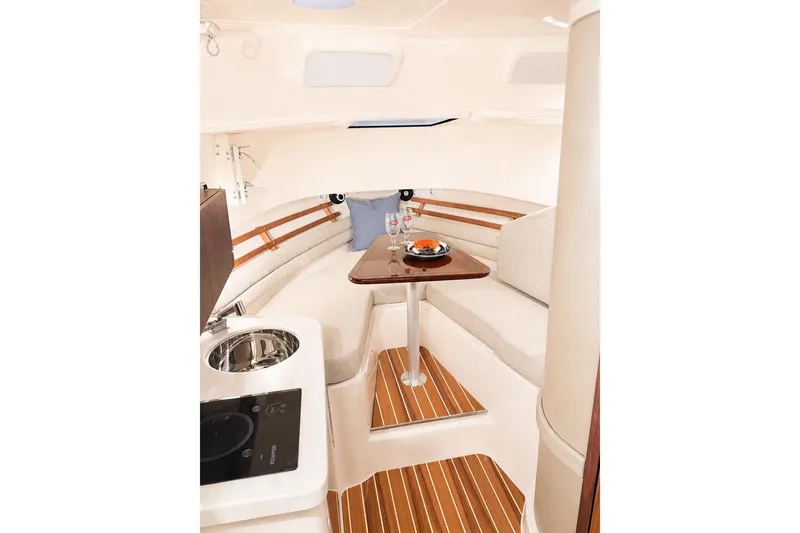 Slide: The Image of Interior of 2007 Grady-White Marlin 300 boat with cozy seating and dining area. - 8