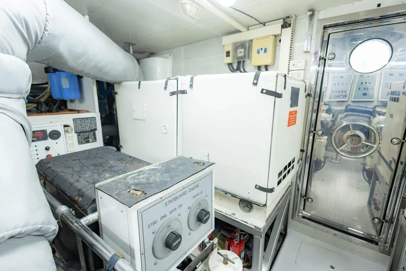 Slide: The Image of Engine room of 2008 Hargrave Enclosed Skylounge MY yacht, featuring control panels and machinery. - 59