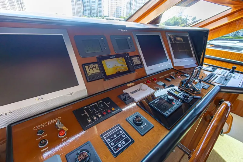 Slide: The Image of Control panel of 2008 Hargrave Enclosed Skylounge MY yacht with navigation screens and controls. - 34