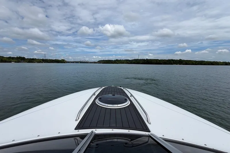 Slide: The Image of Bow view of 2008 Cobalt 303 boat on a calm lake under cloudy sky. - 16