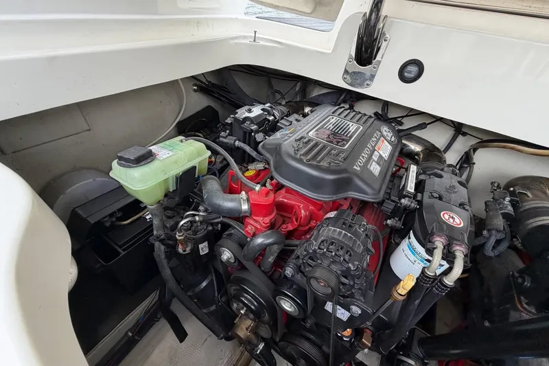 Slide: The Image of Engine compartment of a 2008 Cobalt 303 boat featuring a Volvo Penta engine. - 27