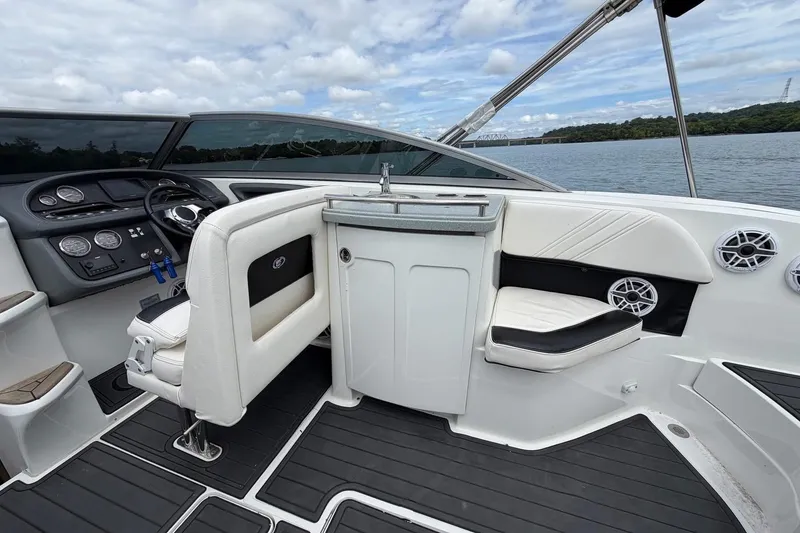 Slide: The Image of Interior of a 2008 Cobalt 303 boat with sleek seating and control panel. - 20