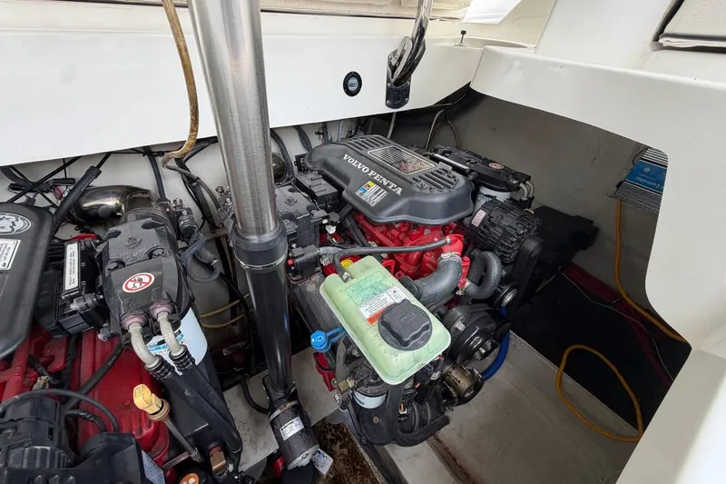 Slide: The Image of Engine compartment of a 2008 Cobalt 303 boat, featuring a Volvo Penta engine. - 26