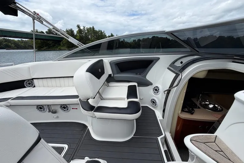 Slide: The Image of Luxurious interior of a 2008 Cobalt 303 boat with sleek seating and modern amenities. - 17