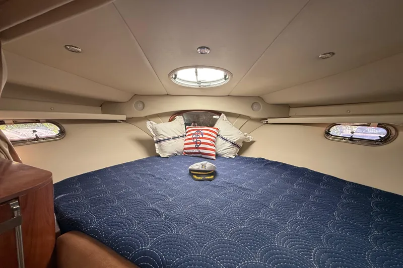 Slide: The Image of Interior cabin of 2006 Four Winns 328 Vista with blue bedding and nautical decor. - 38
