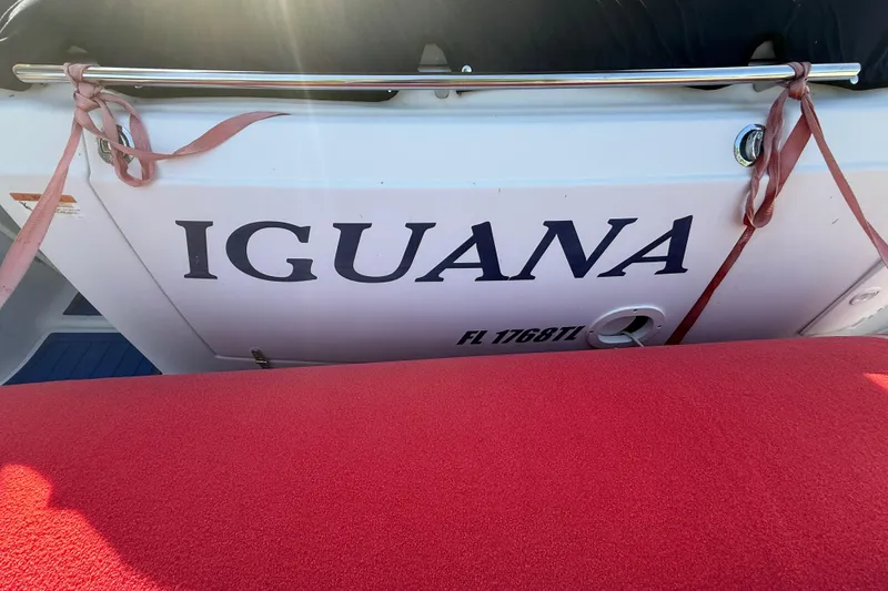 Slide: The Image of 2006 Four Winns 328 Vista boat named "Iguana" with red seating. - 55