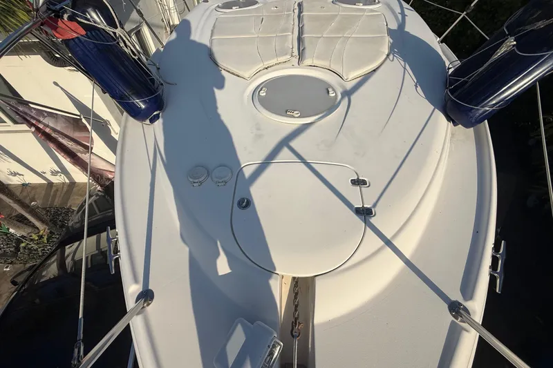 Slide: The Image of 2006 Four Winns 328 Vista boat deck with cushions and safety equipment. - 64
