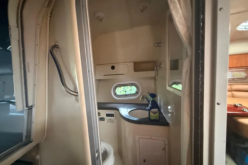 Slide: The Image of Interior of 2006 Four Winns 328 Vista boat bathroom with sink and window. - 45