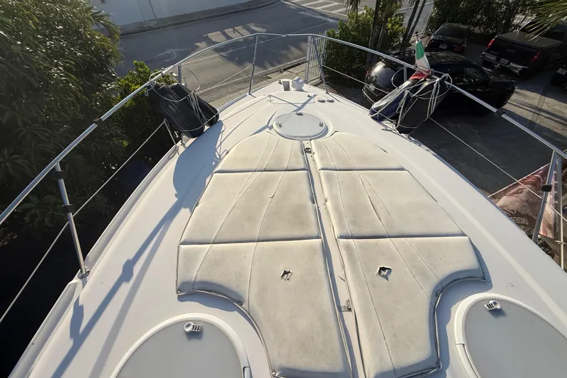Slide: The Image of 2006 Four Winns 328 Vista boat deck with sun pads and railing. - 58