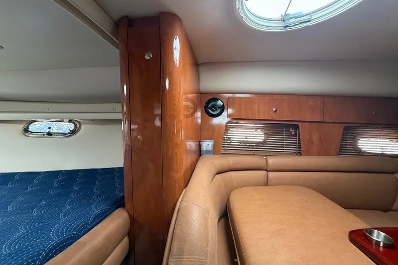 Slide: The Image of Interior of 2006 Four Winns 328 Vista boat with wood paneling and seating. - 41