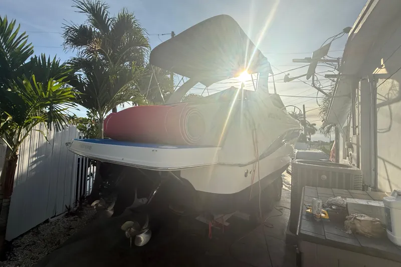 Slide: The Image of 2006 Four Winns 328 Vista boat docked with sun shining through canopy. - 28