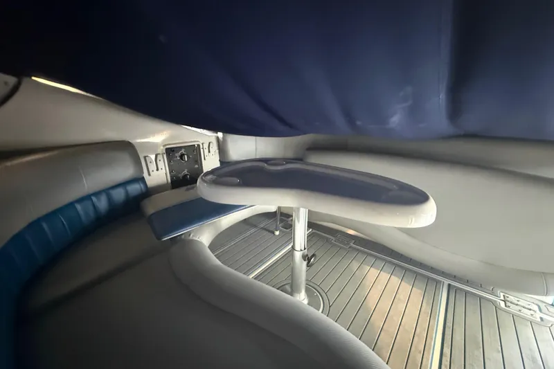 Slide: The Image of Interior seating area of 2006 Four Winns 328 Vista boat with table. - 54