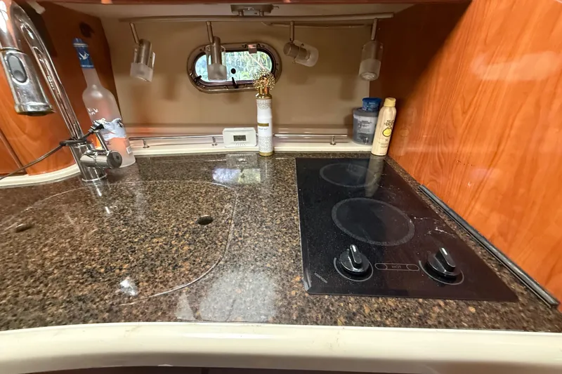 Slide: The Image of 2006 Four Winns 328 Vista yacht kitchen with granite countertop and electric stove. - 47