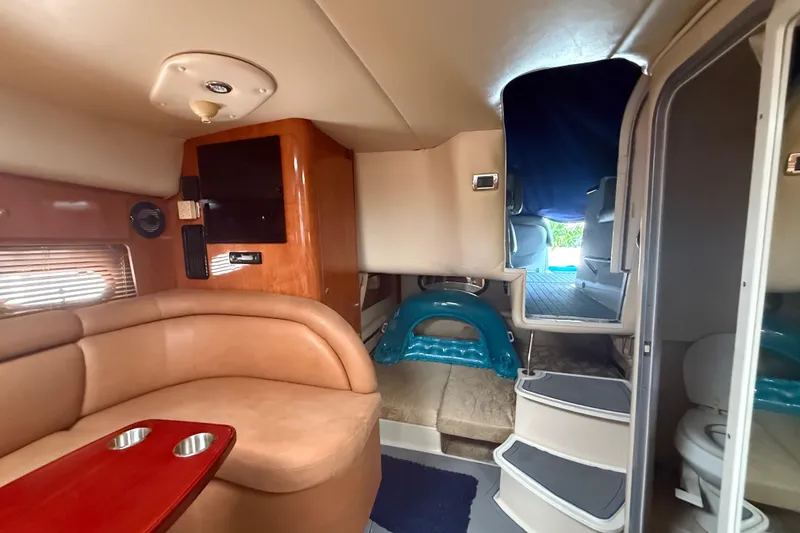 Slide: The Image of Interior of 2006 Four Winns 328 Vista boat with seating, steps, and compact amenities. - 43