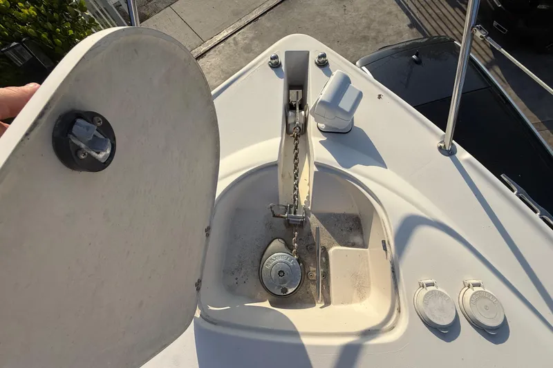 Slide: The Image of Anchor compartment of 2006 Four Winns 328 Vista boat, showing chain and winch. - 61
