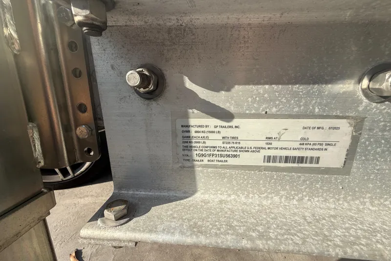 Slide: The Image of Close-up of a GP Trailers boat trailer label, showing specifications and manufacturing details. - 33
