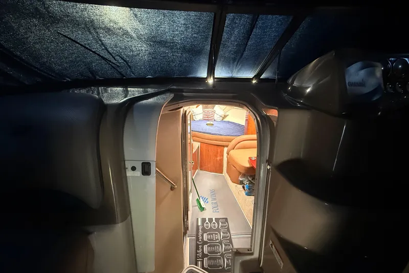 Slide: The Image of Interior view of 2006 Four Winns 328 Vista cabin with cozy seating and ambient lighting. - 53