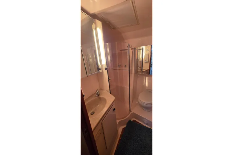Slide: The Image of Bathroom interior of 2004 Tiara Yachts 4000 Express with shower and vanity. - 18