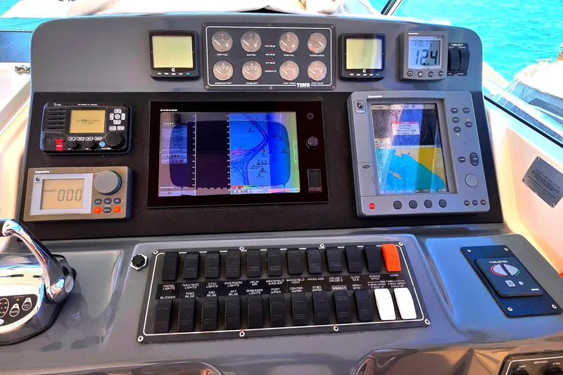 Slide: The Image of Control panel of a 2004 Tiara Yachts 4000 Express with navigation and communication equipment. - 24