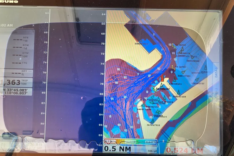 Slide: The Image of Navigation display on a 2004 Tiara Yachts 4000 Express, showing nautical chart and coordinates. - 27