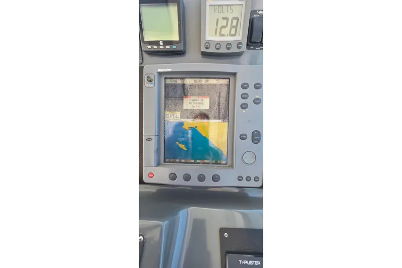 Slide: The Image of Navigation system on a 2004 Tiara Yachts 4000 Express, displaying marine chart and voltage. - 28