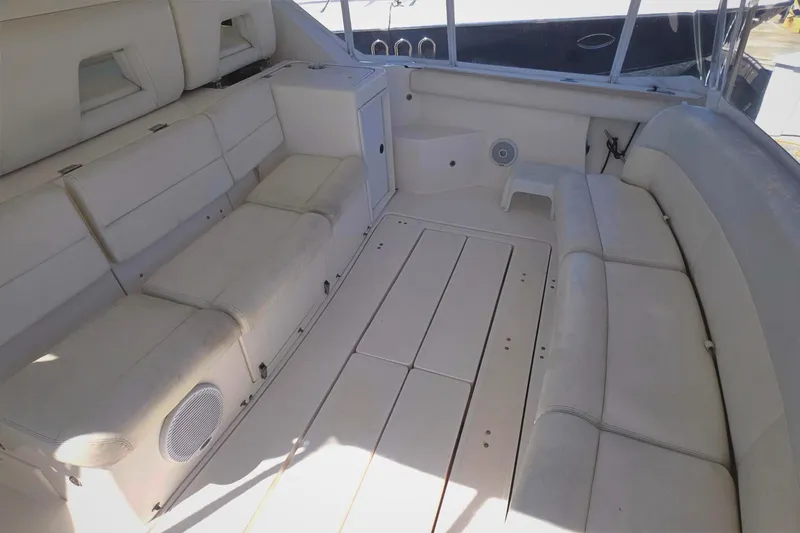 Slide: The Image of 2004 Tiara Yachts 4000 Express interior with white seating and spacious layout. - 34