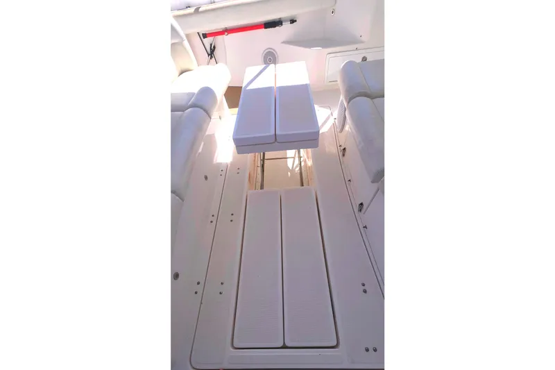 Slide: The Image of 2004 Tiara Yachts 4000 Express deck with seating and table. - 35
