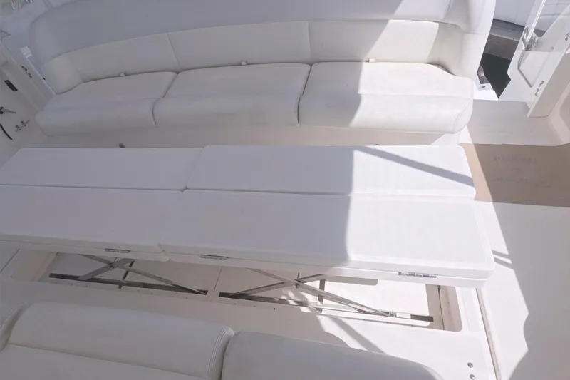 Slide: The Image of 2004 Tiara Yachts 4000 Express interior seating area with convertible table. - 36