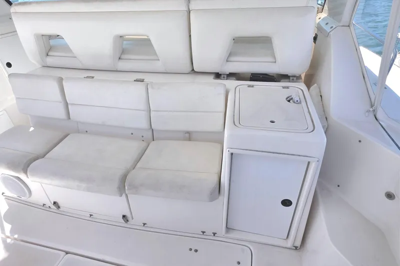Slide: The Image of 2004 Tiara Yachts 4000 Express interior seating and storage area. - 37