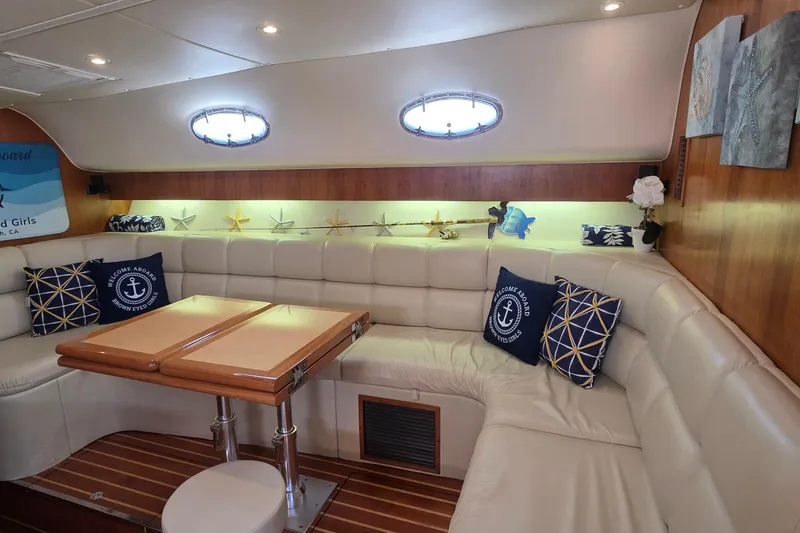 Slide: The Image of Luxurious interior of 2004 Tiara Yachts 4000 Express with plush seating and nautical decor. - 4