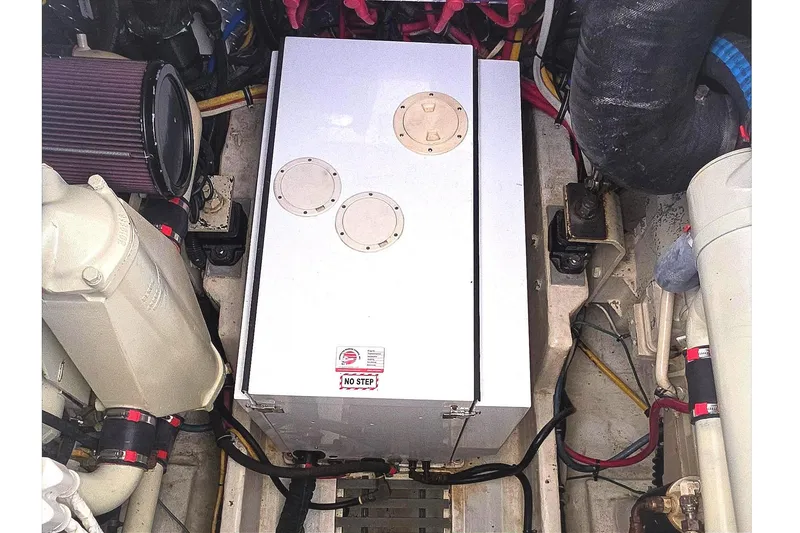 Slide: The Image of Engine compartment of a 2004 Tiara Yachts 4000 Express, showcasing mechanical components. - 45