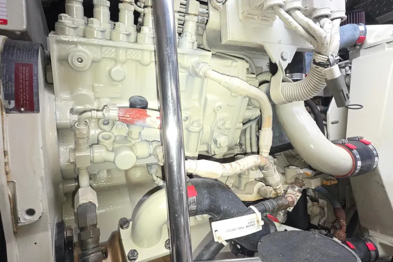 Slide: The Image of Engine compartment of a 2004 Tiara Yachts 4000 Express, showcasing detailed mechanical components. - 47