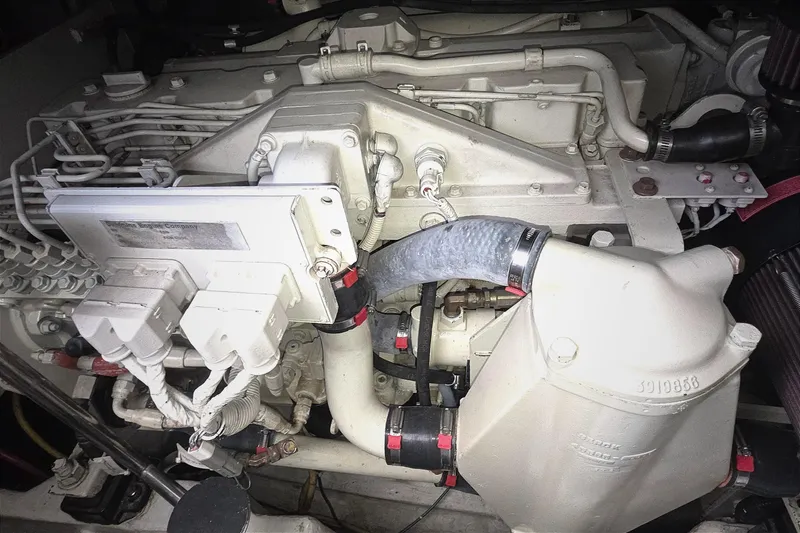 Slide: The Image of Engine compartment of a 2004 Tiara Yachts 4000 Express, showcasing detailed mechanical components. - 48