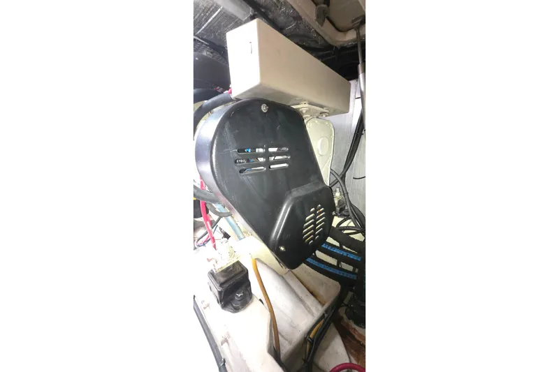 Slide: The Image of Engine compartment of a 2004 Tiara Yachts 4000 Express, showcasing mechanical components. - 49