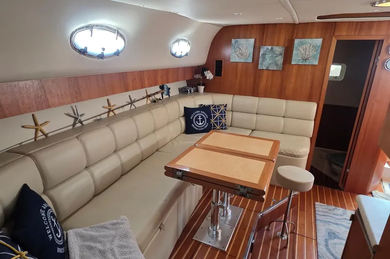 Slide: The Image of Luxurious 2004 Tiara Yachts 4000 Express interior with elegant seating and nautical decor. - 5