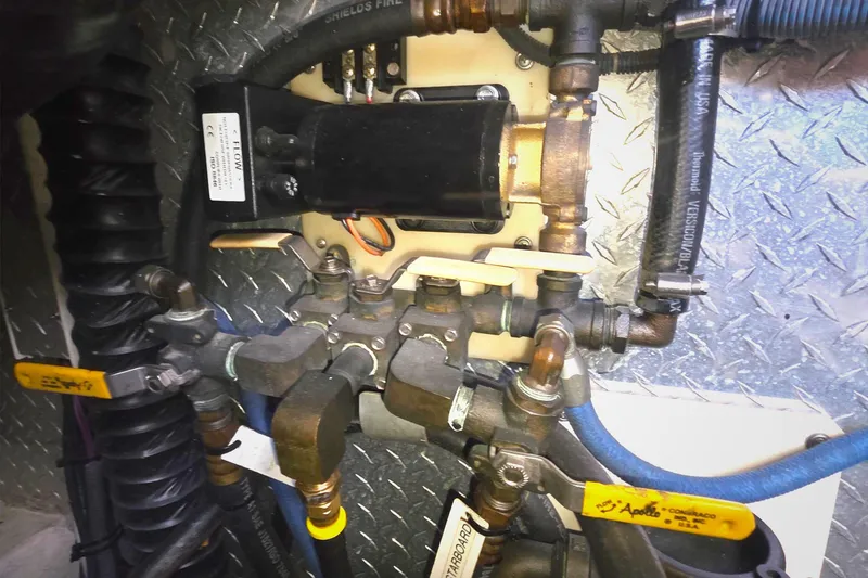 Slide: The Image of Engine room plumbing and valves of a 2004 Tiara Yachts 4000 Express. - 52