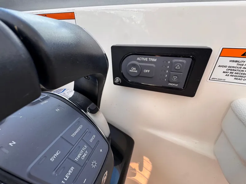 Slide: The Image of Close-up of the control area on a 2018 Sea Ray Sundancer 350. - 19