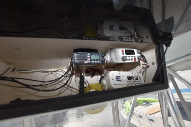 Slide: The Image of 1981 Blackfin 32 Sportfisherman electronics panel with communication devices and wiring. - 11