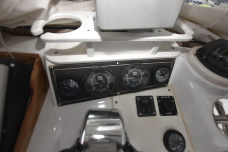 Slide: The Image of Dashboard of a 1981 Blackfin 32 Sportfisherman boat with gauges and controls. - 13