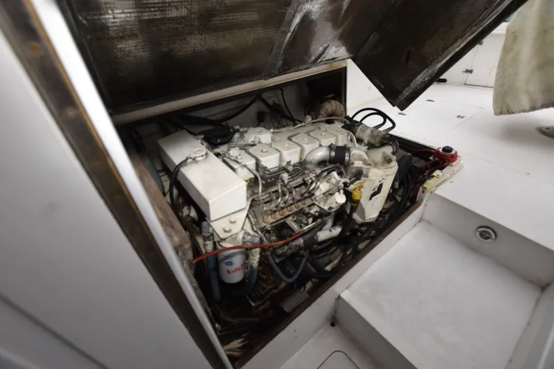 Slide: The Image of Engine compartment of a 1981 Blackfin 32 Sportfisherman boat, showcasing mechanical components. - 17