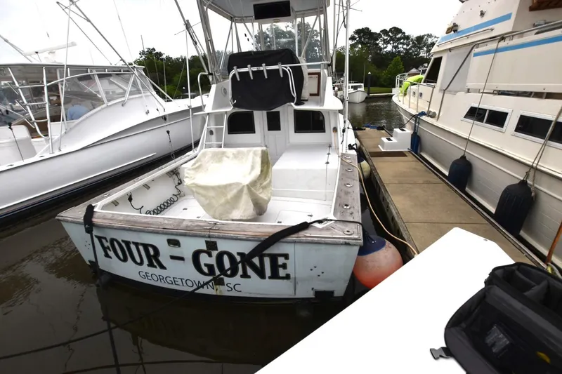Slide: The Image of 1981 Blackfin 32 Sportfisherman docked, named "Four Gone," in Georgetown, SC marina. - 3