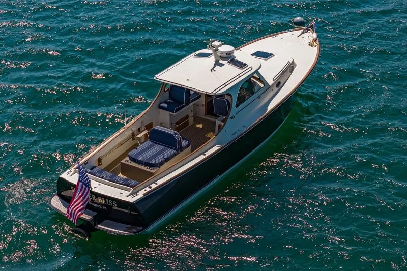 Slide: The Image of 2001 Hinckley Picnic Boat 36 Classic cruising on sparkling blue water. - 12
