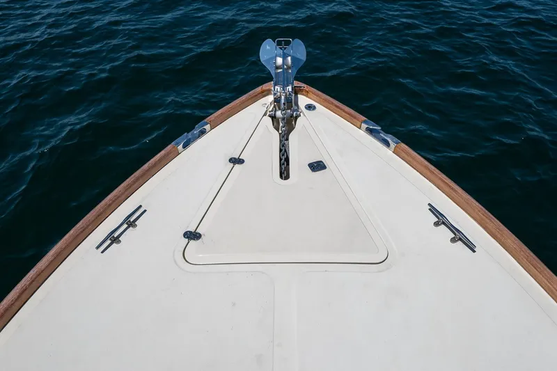 Slide: The Image of Bow of 2001 Hinckley Picnic Boat 36 Classic on calm water. - 17