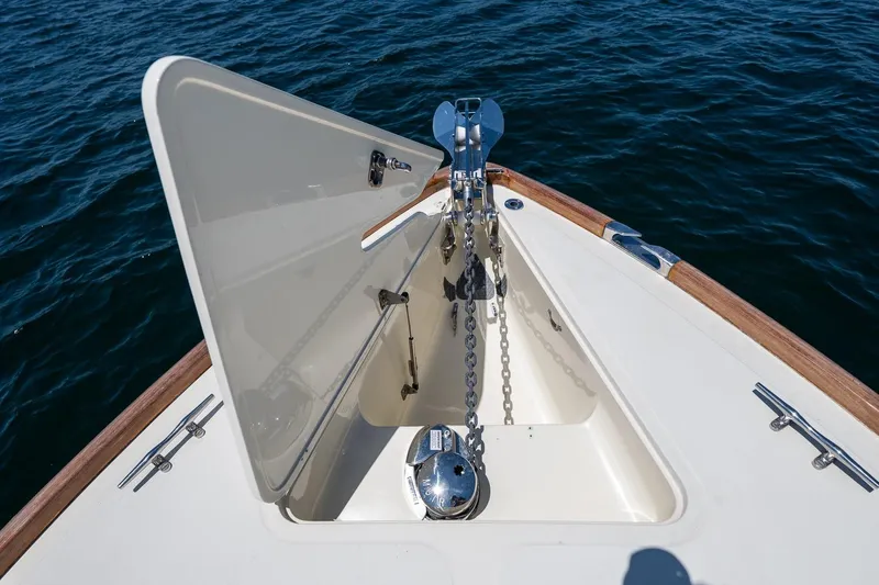 Slide: The Image of Bow anchor compartment of 2001 Hinckley Picnic Boat 36 Classic on water. - 18