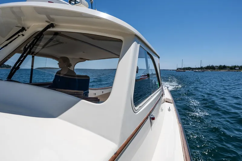 Slide: The Image of 2001 Hinckley Picnic Boat 36 Classic cruising on a sunny day, with scenic ocean views. - 19